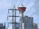 The Calgary Tower is shown behind power lines in downtown Calgary on Wednesday.  Power consumption is at a peak due to the recent cold weather.