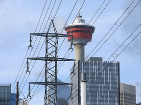 The Calgary Tower is shown behind power lines in downtown Calgary on Wednesday. Power consumption is at a peak due to the recent cold weather.