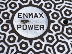 An Enmax manhole cover is shown in downtown Calgary on Wednesday, December 21, 2022.  A good portion of western Canada is under severe weather warnings.  Jim Wells/Postmedia