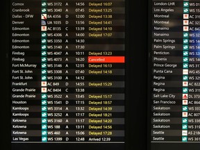 A list of delayed and canceled flights is shown for part of the afternoon, Tuesday, December 27, 2022 at Calgary International Airport Calgary.