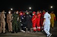 Army personnel and rescue crew gather at a makeshift rescue operation site during the search for survivors of the capsizing of the Thai naval vessel HTMS Sukhothai about 37 kilometres (22 miles) off the southeastern coast on Sunday night, at Bang Saphan Pier in Prachuap Khiri Khan district, on December 19, 2022.