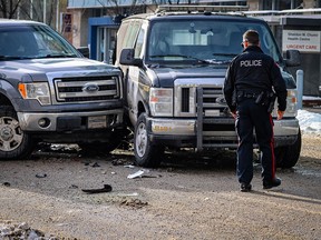 Calgary police investigate after a police van with two officers in it was rammed by a stolen vehicle at the traffic lights out front of the Sheldon M. Chumir Health Centre in downtown Calgary on Sunday, December 25, 2022.