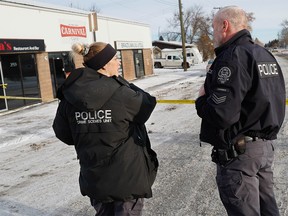 Police investigate after a fatal shooting in the southeast community of Forest Lawn on Sunday, December 25, 2022.