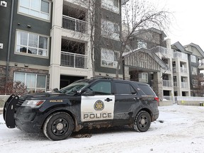 A Calgary police vehicle was photographed at a suspicious death scene at a condominium complex on Richard Court S.W. on Monday, December 5, 2022. Police were called after a women’s body was found in one of the residences.