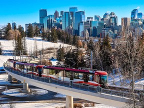 A CTrain on the Red Line crosses a bridge below SAIT on Wednesday, December 14, 2022. Starting Monday, four-car trains will be returning to the Red Line along with boosted train frequency during peak hours.