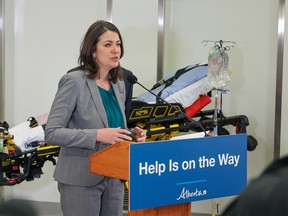 Premier Danielle Smith speaks during a press conference on a new initiative to use alternative modes of transportation for non-emergency transfers to hospital. The goal is to help free up paramedics and ambulances for emergency calls. The announcement took place in a training lab at the Cal Wenzel Precision Health Building next to the Foothills hospital on Wednesday, December 21, 2022.