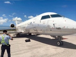 A Pivot Airlines plane sits at the Dominican Republic airport after 210 kilograms of cocaine were found stashed on board.