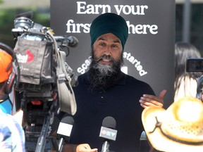 NDP Leader Jagmeet Singh speaks to reporters in East Village during a visit to Calgary on July 17, 2021.