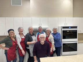 Volunteers with Brown Bagging for Calgary’s Kids prepare school lunches.