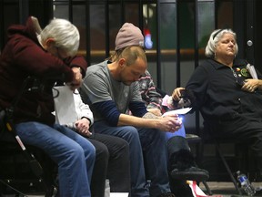 Family and friends gather at City Hall in Calgary on Wednesday, December 21, 2022, during the seventh annual Longest Night of the Year Memorial.