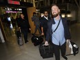 Pivot Airlines employee Alexander Rozov and fellow flight members at Toronto Pearson International Airport, Thursday December 1, 2022, after returning to Canada from the Dominican Republic where they had been detained after reporting a bag of cocaine onboard their plane in April of this year.