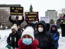 Counter-protesters stand in the background during an anti-sovereignty rally at the Legislature in Edmonton Alberta, December 4, 2022. Jason Franson for Postmedia
