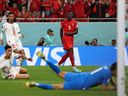 Canada's Sam Adekugbe watches his shot deflect off a defender's foot into the Morocco net during Thursday's FIFA World Cup match.