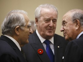 From left: lawyer Sam Wakim, former prime minister Brian Mulroney and former U.S. senator George Mitchell attend the Economic Club of Canada in Toronto, November 2016.