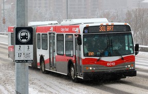 A BRT rapid transit bus is traveling north on Center Street.