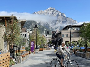 Visitors enjoy Bear Street's new pedestrian-friendly design in downtown Banff.