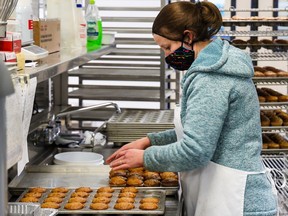Staff work in the bakery area at Calgary Meals On Wheels on Wednesday, November 30, 2022.