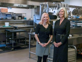 Calgary Meals on Wheels co-executives Stephanie Ralph, left, and Janice Curtis in the agency's kitchen area on Wednesday, Nov. 30, 2022.