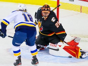 Calgary Flames goaltender Jacob Markstrom gets a pad on this shot by St. Louis Blues forward Robert Thomas at the Scotiabank Saddledome in Calgary on Friday, Dec. 16, 2022.