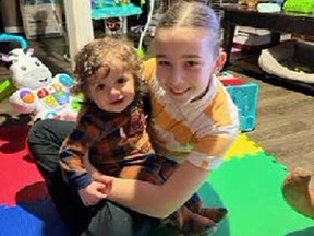 In the photo are 11-month-old Deckard and 12-year-old Charlee, who have been missing since December 5.