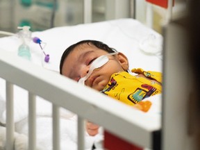A child suffering from an RSV infection receives care at the pediatric intensive care unit at the Asklepios Clinic in Sankt Augustin, Germany, December, 6, 2022.