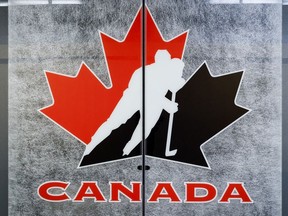 A Hockey Canada logo is seen on the door to a meeting room at the organization's head office in Calgary, Alta., Sunday, Nov. 6, 2022.