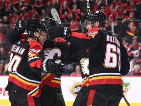 Dec 3, 2022; Calgary, Alberta, CAN; Calgary Flames forward Blake Coleman (20) celebrates his goal against the Washington Capitals with teammates in the first period at Scotiabank Saddledome. Mandatory Credit: Candice Ward-USA TODAY Sports