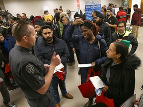 Hundreds of job seekers turned out for a job fair at the Genesis Centre in northeast Calgary on Nov. 19. Representatives from companies and organizations such as WestJet, EllisDon Construction, Amazon, and Calgary Police Service were looking to fill positions.