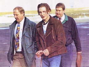 Ryan Love arrives under arrest in Calgary on November 13, 1992 escorted by RCMP Cpl.  Doug Morrison, left, and Banff RCMP Const.  Nigel Patterson.