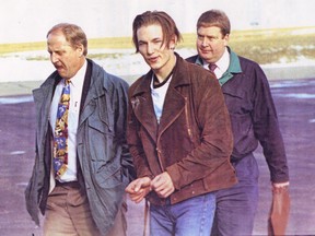 Ryan Love arrives under arrest in Calgary on November 13, 1992 escorted by RCMP Cpl. Doug Morrison, left, and Banff RCMP Const. Nigel Patterson.