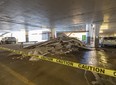 Extreme cold and a water leak caused "cosmetic damage" to a parkade ceiling at West Edmonton Mall, a spokesperson told Postmedia. Slabs of building material lie stacked below the site of the damage near entrance 56 at the west side of the mall on Dec. 22, 2022.