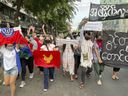 Pro-democracy protesters hold a flash rally to protest Myanmar's military-installed government, at Kyauktada township in Yangon, Myanmar, December 20, 2021. Canada sanctions dozens of officials and companies from three of the world's worst human rights regimes .