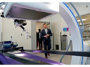 Dr. D'Arcy Durand, surgical director and CEO of Alberta Surgical Group, enters a surgical suite during the opening tour of Edmonton's newest and most advanced chartered surgical facility, which will provide publicly funded orthopedic surgeries under contract to Alberta Health Services.