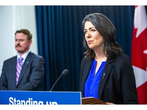 Premier Danielle Smith and Justice Minister Tyler Shandro share details at the Alberta legislature on legislation intended to defend the province's interests on Tuesday, Nov. 29, 2022.