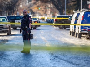 Calgary police investigate a shooting at 7th Street S.W. between 14th and 13th Avenue on Friday, Jan. 6, 2023.