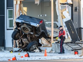 Calgary police are investigating the scene where a truck drove into a house at the intersection of 76 Avenue and 20A St. S.E. on Friday, January 6, 2023.