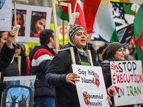 Hundreds of Calgarians gathered outside City Hall to honor the memory of the victims of flight PS752 and demand justice on Sunday, January 8, 2023. Passenger flight PS752 from Tehran to Kiev was shot down by the Islamic Republic of Iran's Revolutionary Guard on this day in 2020, killing everyone on board.