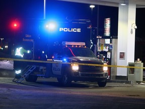 Police investigate the scene at Falconridge Drive and Falsbridge Drive N.E. after a CPS member was killed on Friday, Jan. 1, 2021.