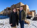 Gerrard Oishi, Habitat for Humanity Southern Alberta president and CEO, left, and Avalon Master Builder CEO Ryan Scott pose for a photo on Tuesday, Jan. 17, 2023.