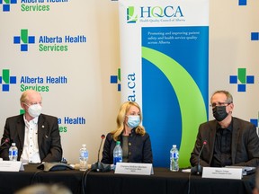 Dr. John Cowell, official administrator with AHS, left, Charlene McBrien-Morrison, HQCA CEO, and Mauro Chies, interim AHS president and CEO, announce the details of an official report on the fatal dog attack, which took place on June 5, 2022, detailing recommendations to improve emergency response time in Alberta on Thursday, January 19, 2023.