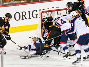 Calgary Flames forward Tyler Toffoli battles Columbus Blue Jackets forward Gustav Nyquist at Scotiabank Saddledome in Calgary on Monday, Jan. 23, 2023.