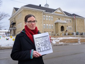 Graphic recorder and mother of two Sam Hester poses for a portrait outside Ramsay School holding the copy of a slide from the letter she has sent to CBE about the indoor air quality in Calgary schools on Wednesday, January 25, 2023.