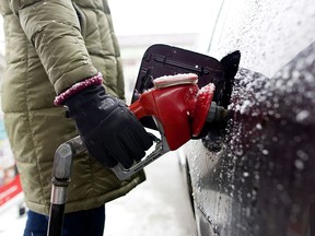 A driver fills up at a station in Calgary.