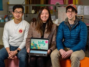 From Left; Patrick Teoh, Volly app director and treasurer, Alice Lam, Volly co-founder, and Mark Maillet, Volly co-founder, pose for a portrait at Good Neighbour community market on Wednesday, December 21, 2022.