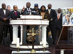 Flanked by the parents of Tyre Nichols and faith and community leaders, civil rights attorney Ben Crump speaks next to a photo of Nichols during a press conference on January 27, 2023 in Memphis, Tennessee. Tyre Nichols, a 29-year-old Black man, died three days after being severely beaten by five Memphis Police Department officers during a traffic stop on January 7, 2023.