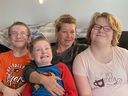 Jennifer Allan and her three special needs children.  Left to right are Rylan (12), Frankie (7), mother Jen and Makayla (9).
