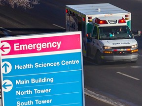 An ambulance drives towards the emergency entrance at the Foothills hospital in Calgary on Monday, January 16, 2023.