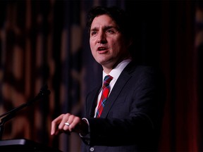 FILE PHOTO: Canada's Prime Minister Justin Trudeau speaks at the Liberal National Caucus holiday party in Ottawa, Ontario, Canada, December 14, 2022.