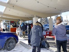 Calgarians lined up to say goodbye to CB Drive Inn's Young “Papa” Lee and his wife Shain “Mama” Lee as they worked their last day serving burgers and fries on Sunday, January 29, 2023 after 30 year in Calgary.