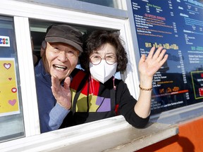 CB Drive Inn’s Papa and Mama Lee, Young and Shain, bid farewell to customers as they worked their last day serving burgers and fries after 30 years in Calgary on Sunday, January 29, 2023.